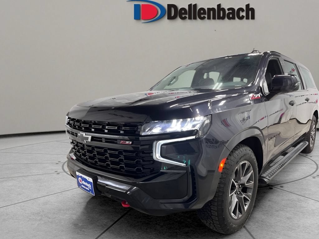 2023 Chevrolet Suburban Z71 in Dark Ash Metallic — front three-quarter view