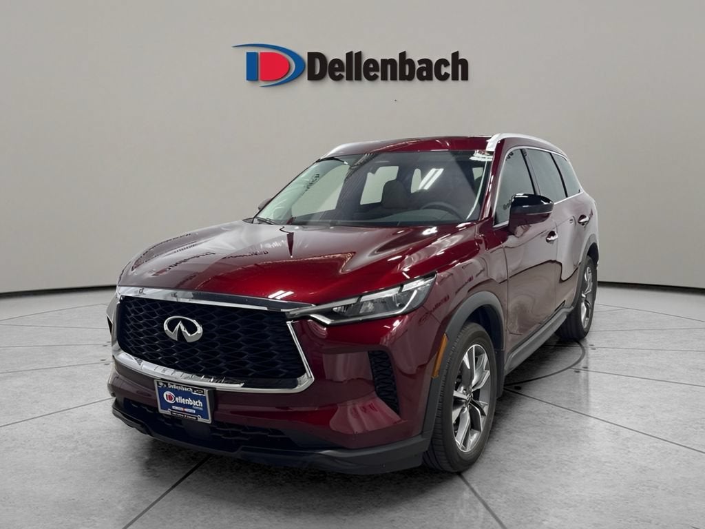 2025 INFINITI QX60 LUXE in Deep Bordeaux — front three-quarter view