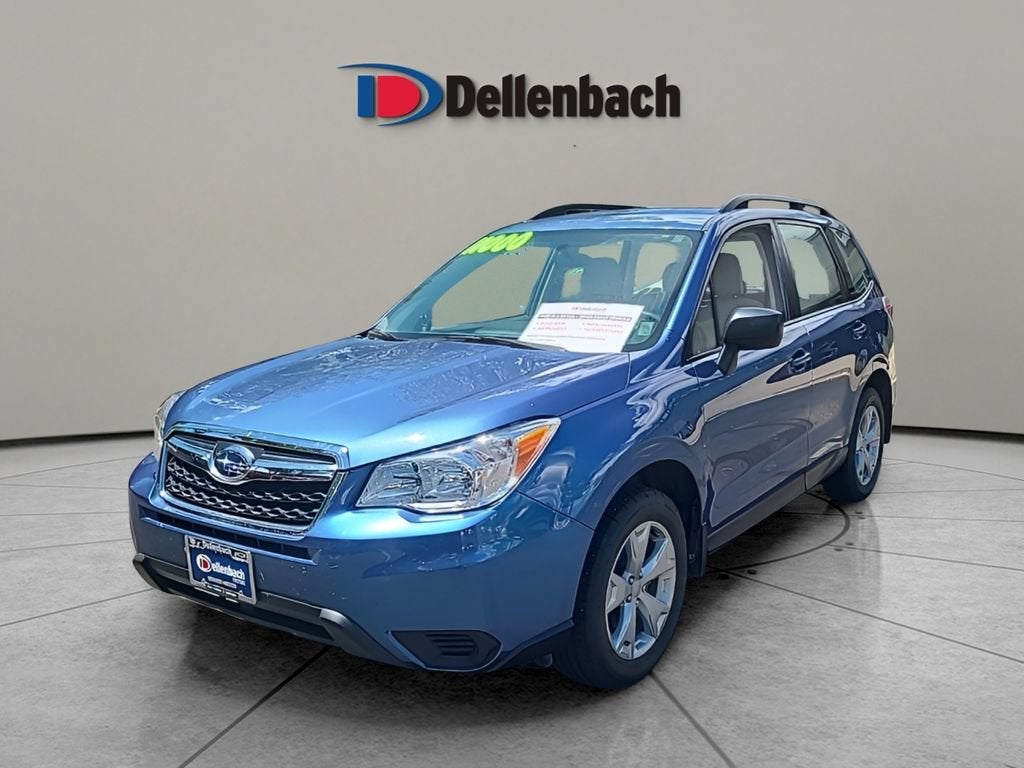 2016 Subaru Forester 2.5i in Quartz Blue Pearl — front three-quarter view